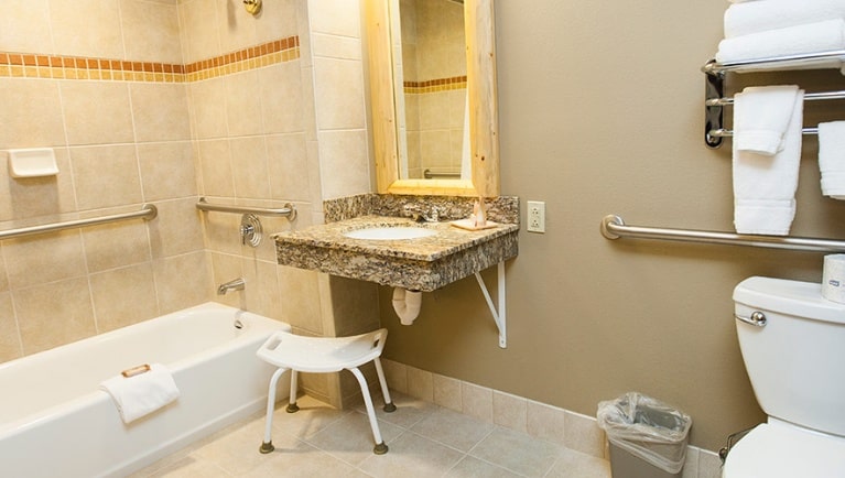 The accessible bath in the Wolf Den Suite